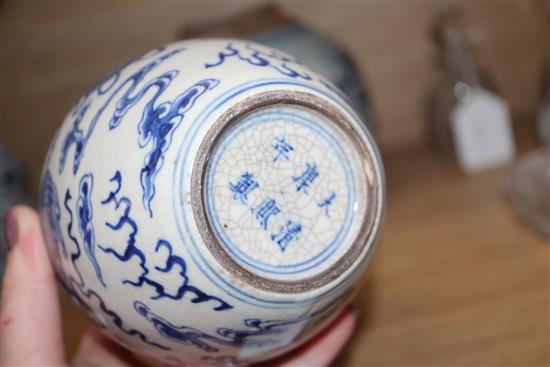 A Chinese blue and white lion-dog jar, Kangxi mark but late 19th century and a 19th century blue and white jar tallest 17cm, lacking